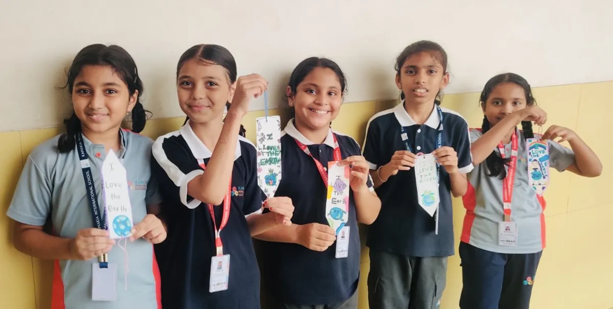 Primary students showing their handmade bookmarks at Kanakia International School, Mira Road