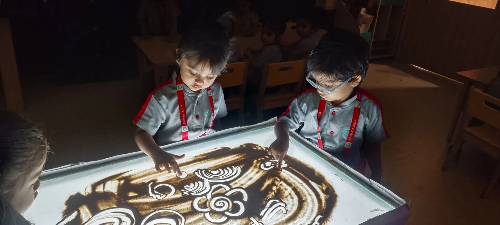 Sand art on a light table